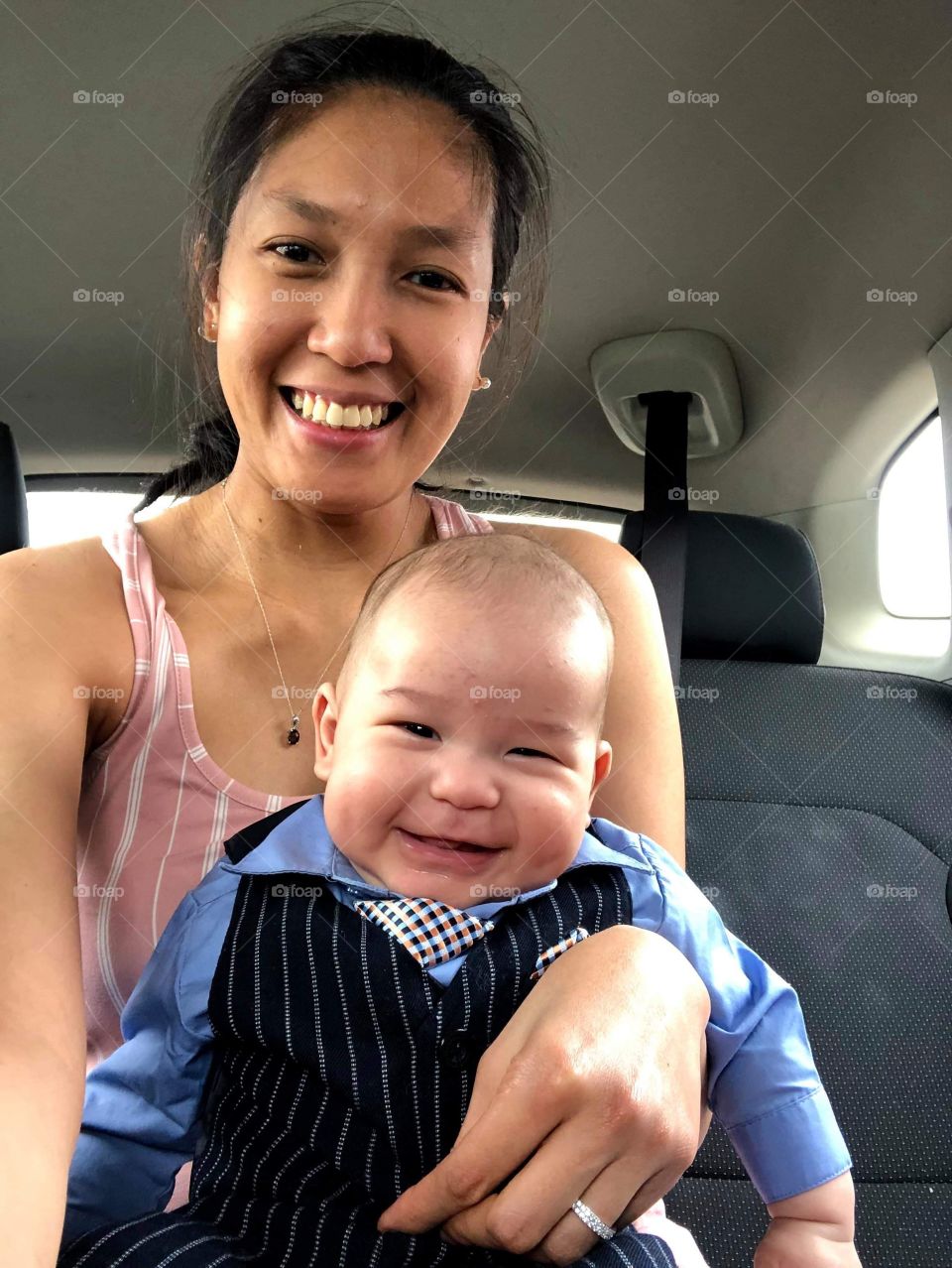 Mother and baby selfie smiling.