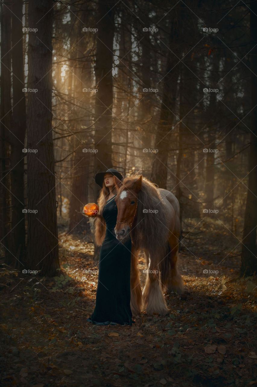 Beautiful woman portrait with horse. Halloween theme