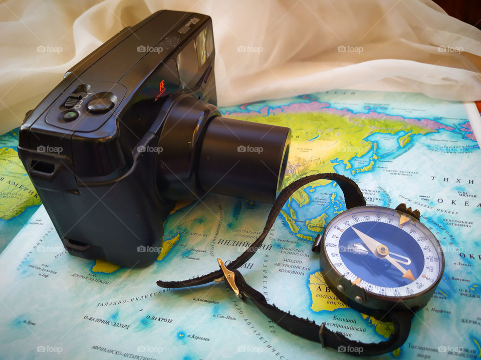 Camera.  Compass.  World map