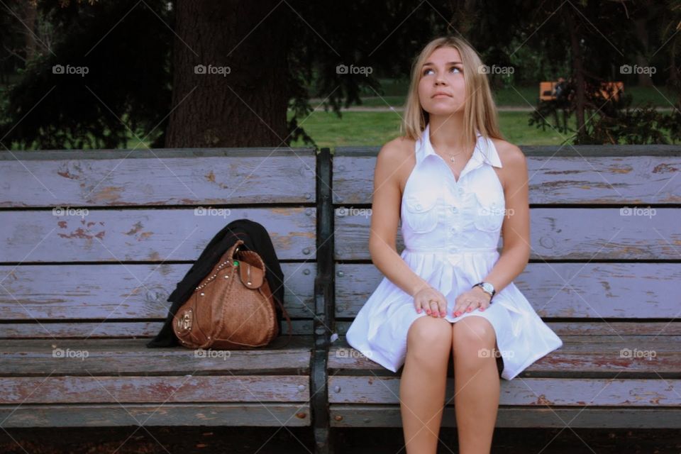 beautiful blonde girl in white dress.