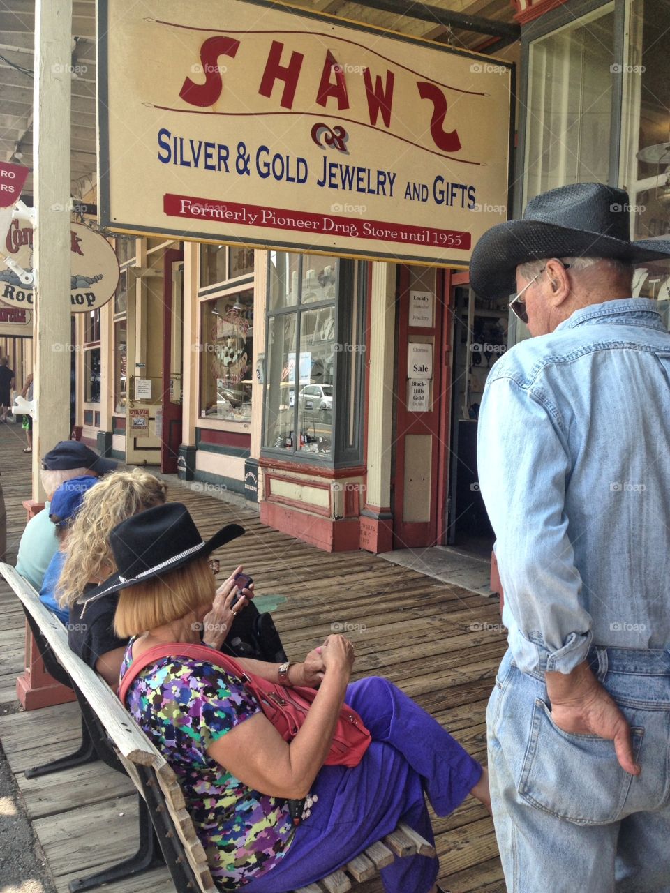 Elderly senior cowboy in old west town