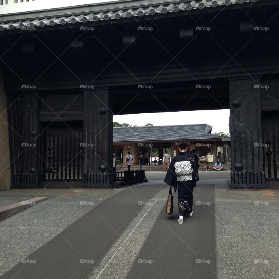  Kimono at the gate. Woman in kimono at Kanazawa Castle, Ishikawa, Japan. 