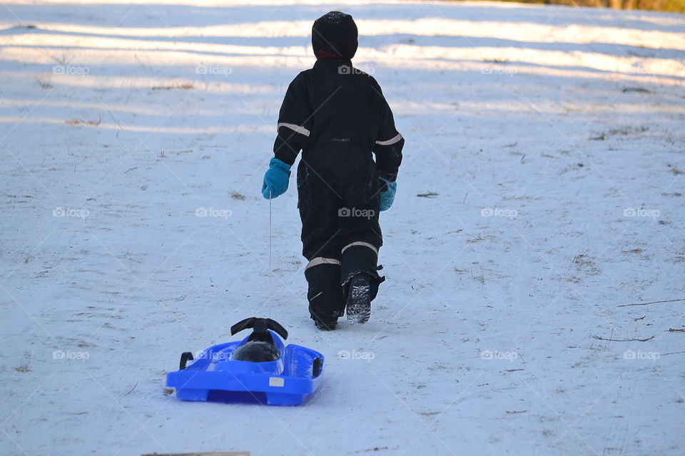 Boy with his sled