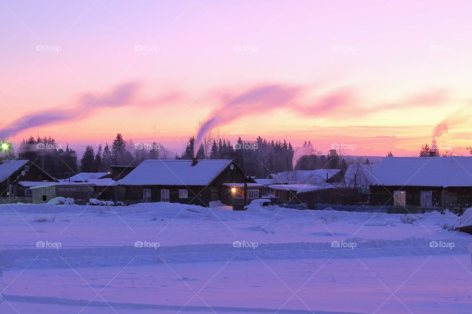 colourful sunrise in the winter in the village