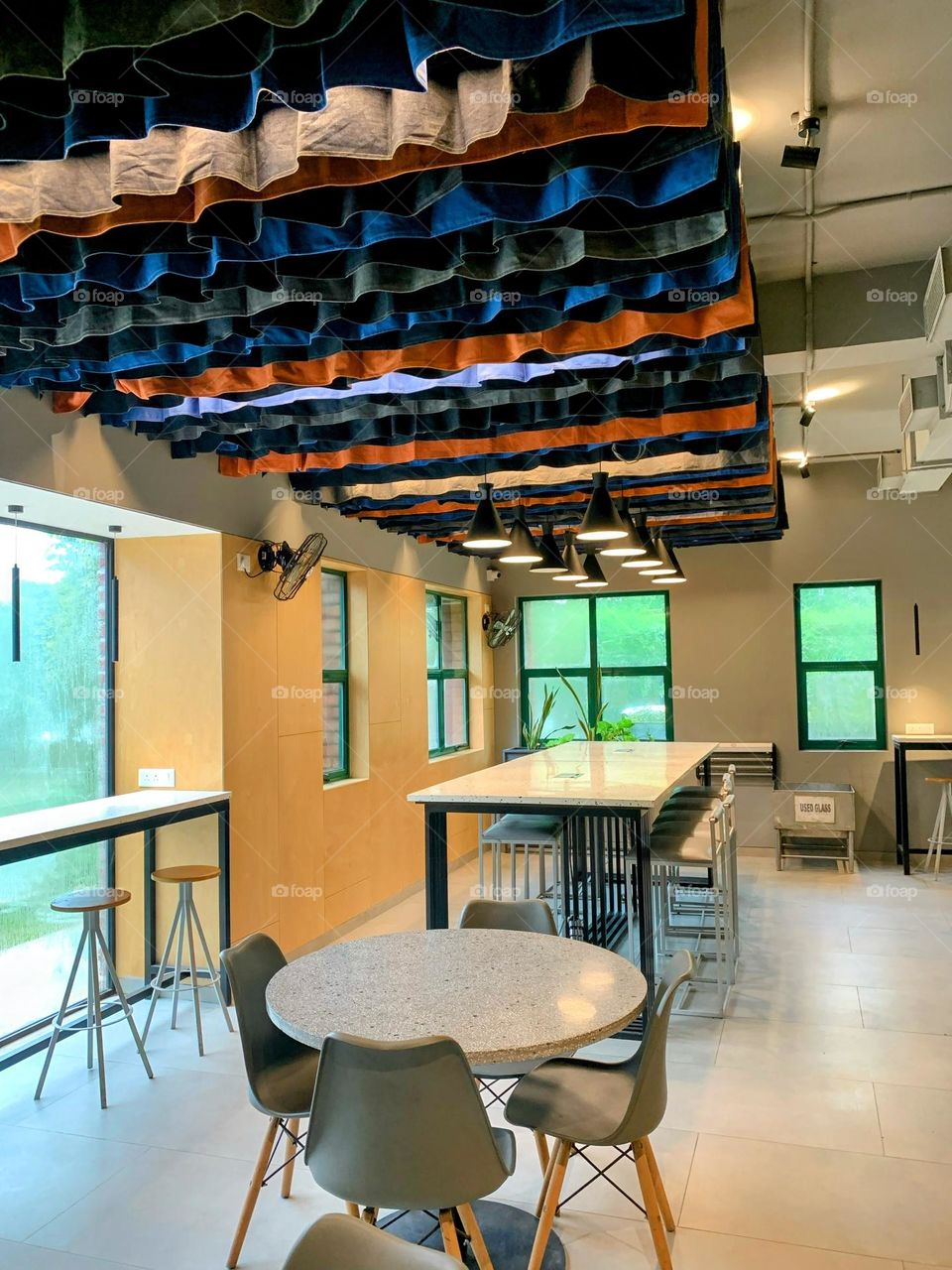 Colorful Cafe full of green surroundings 