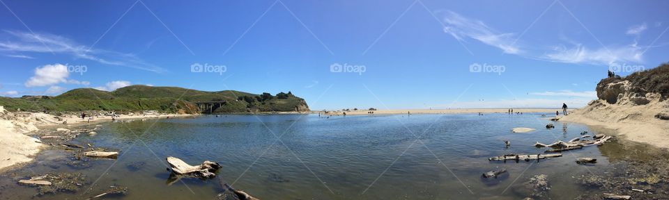 People at a lagoon, water body