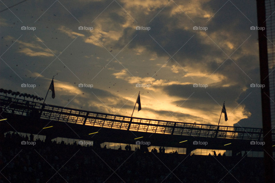 Sun setting over shea stadium after the final game before it was torn down