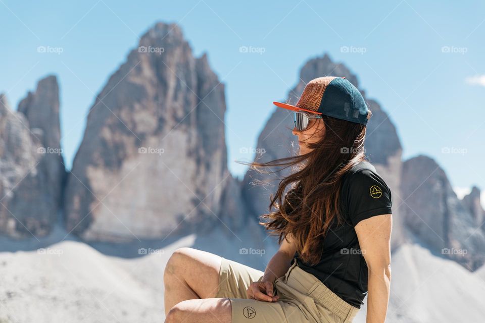 Woman standing in front of Tre Cime di Lavaredo.