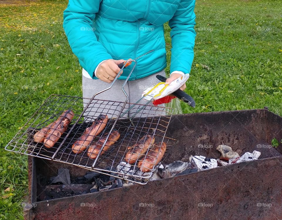 My daughter is making hot dogs.