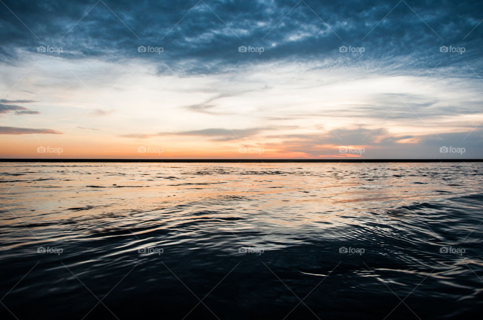 Sea and sky at sunset showing very contrastive colora