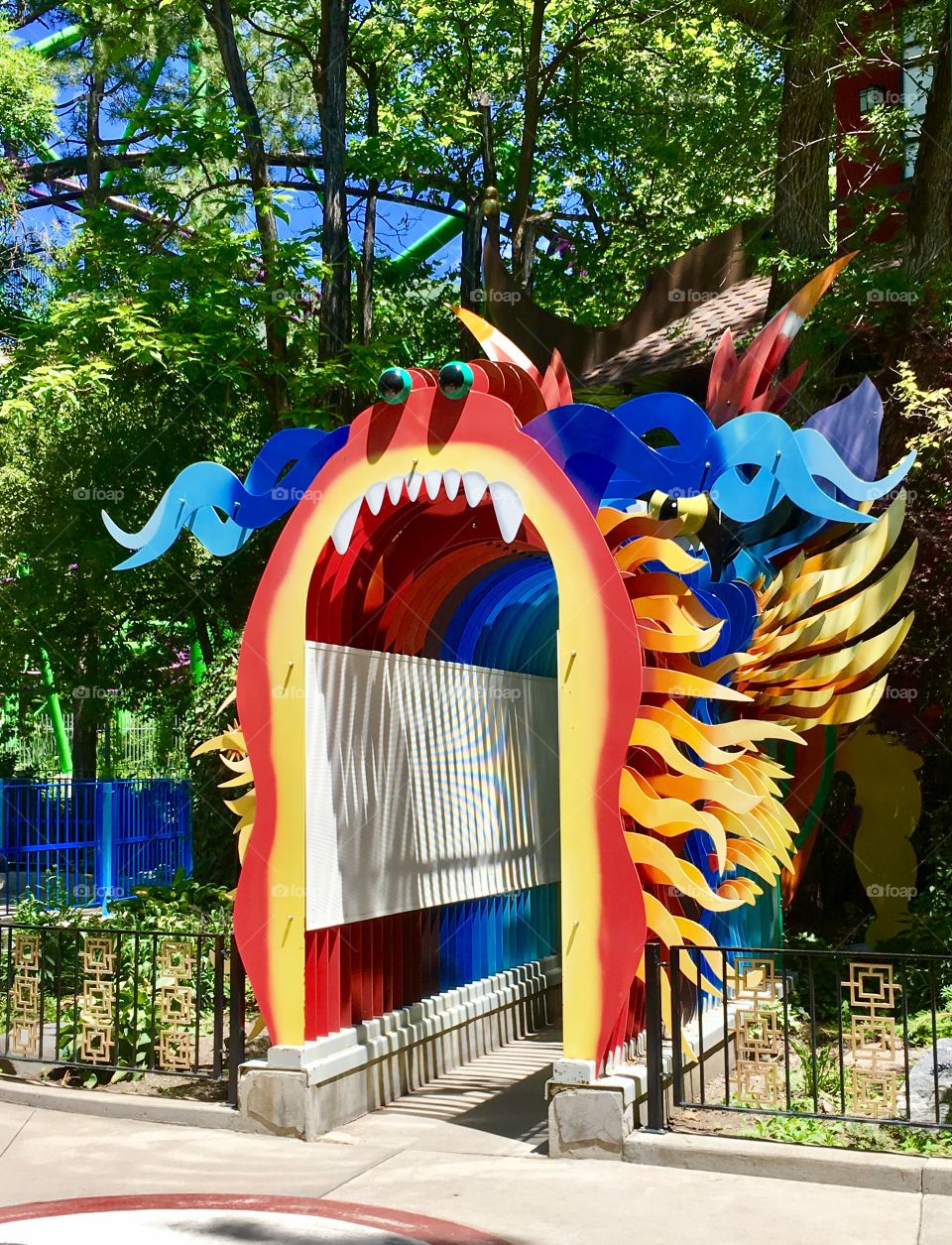 Cool dragon. Metal art. Amusement ride. Bright. Teeth. 