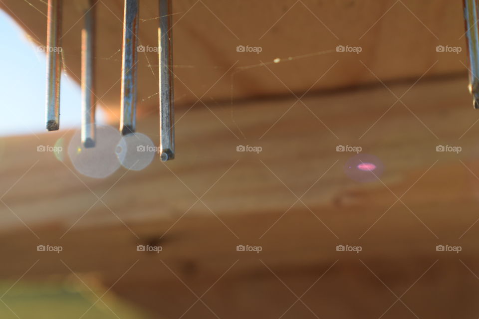 A pile of wood with nails sits in my home town.