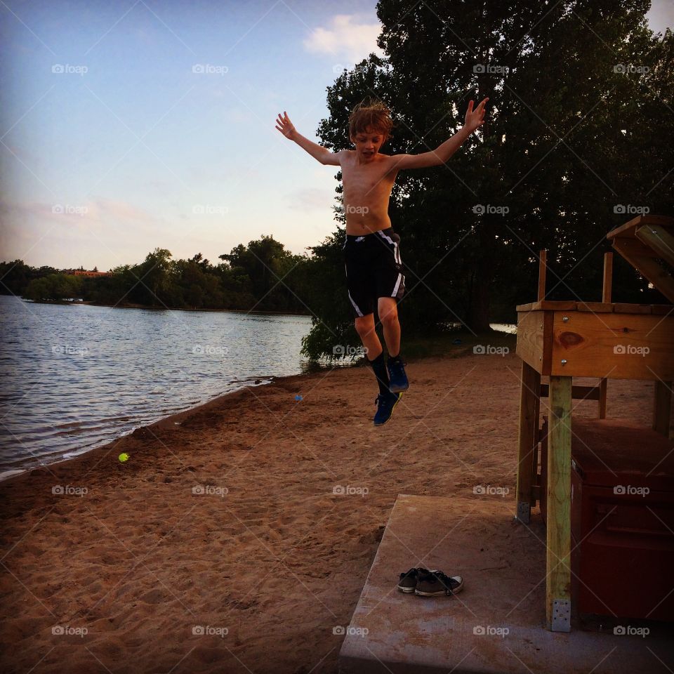 Child jumping. My child jumping off lifeguard station at Cedar Lake in Minneapolis 
