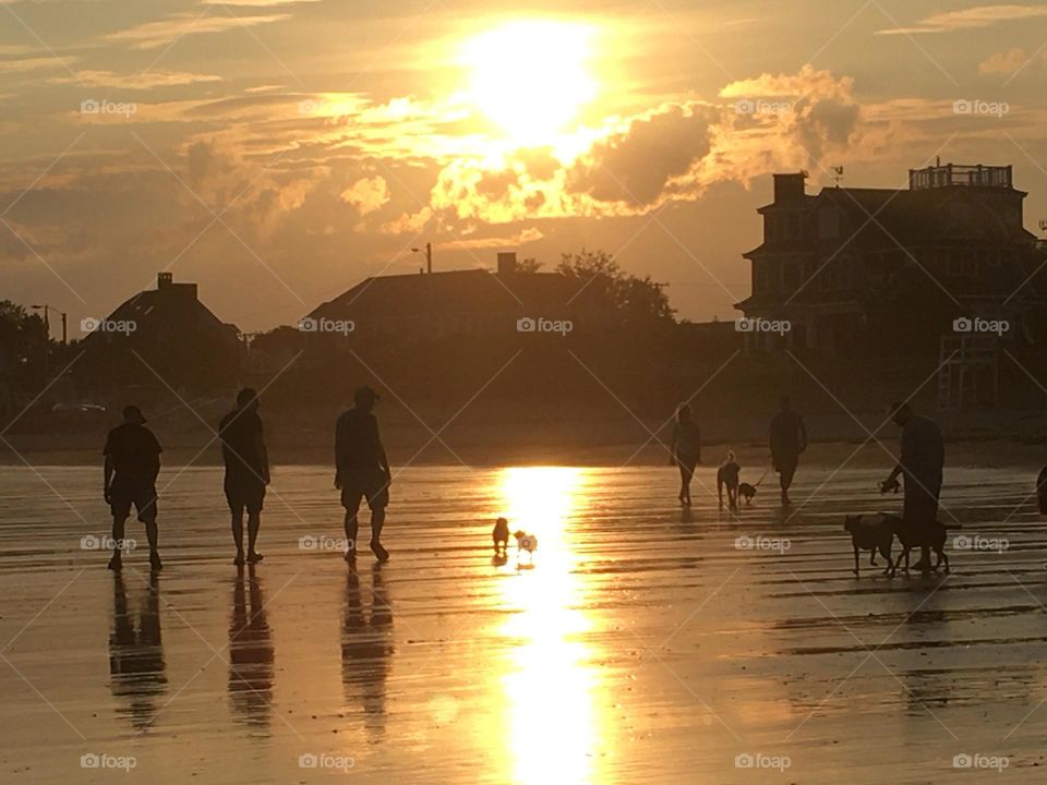 People on beach at dawn 