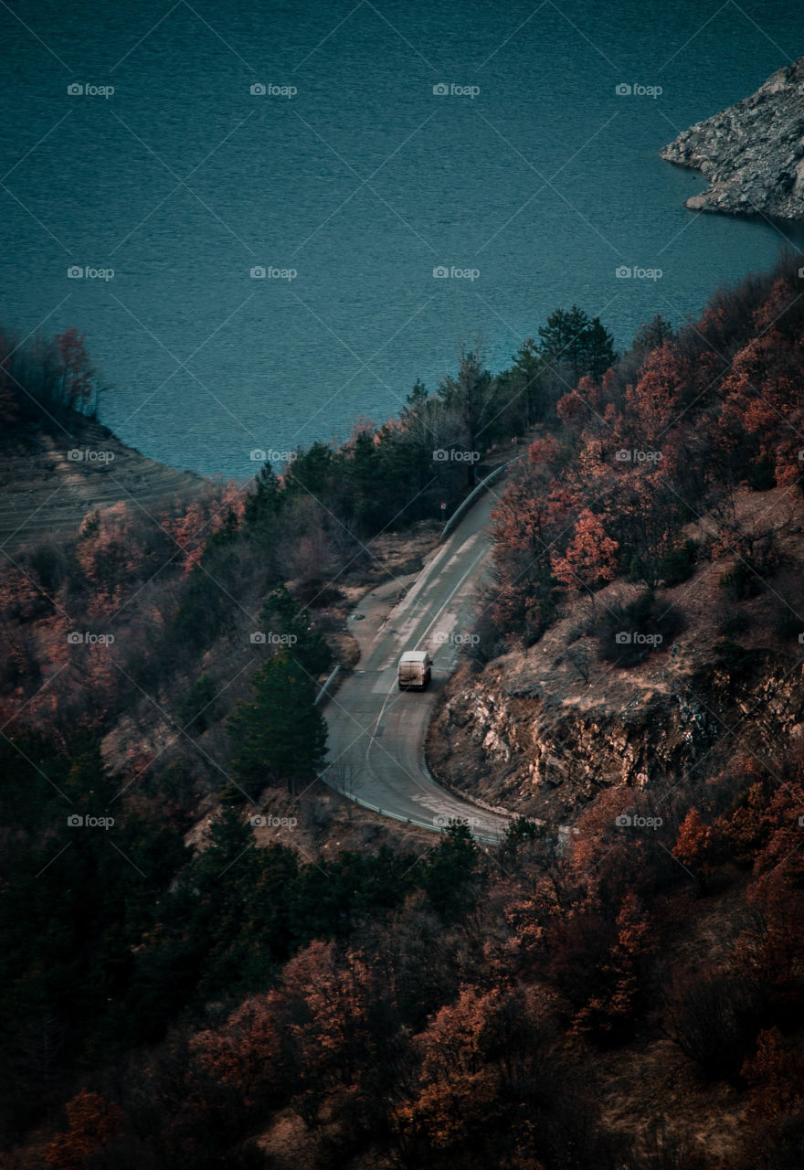 Car passing through mountains.