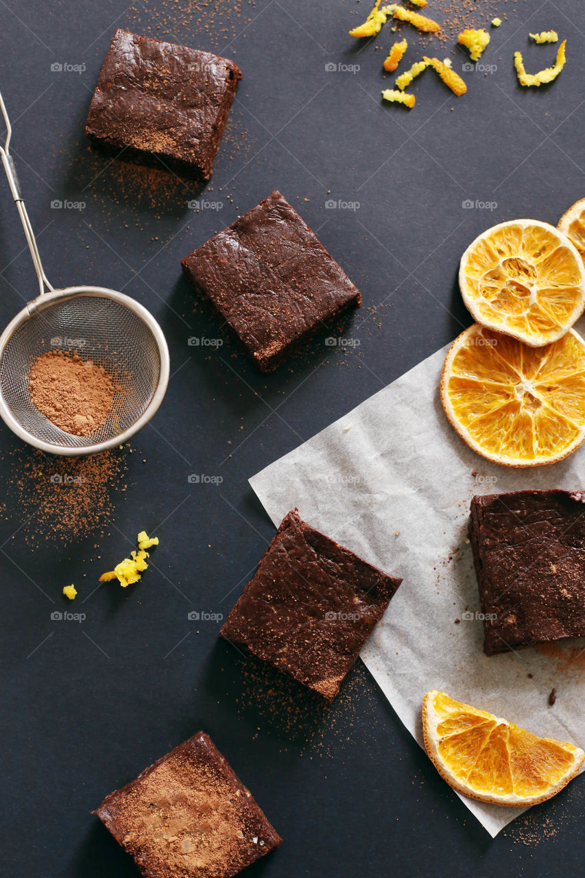 Citrus infused brownies sprinkled with cacao powder.