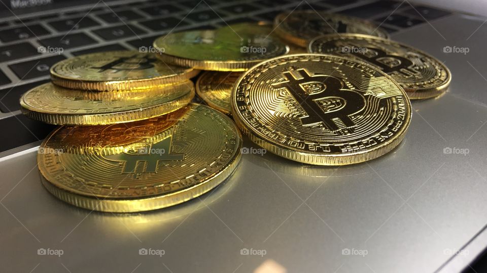 Close up on Gold bitcoin on keyboard 