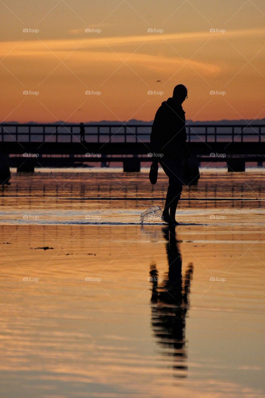 Walking along the beach after work