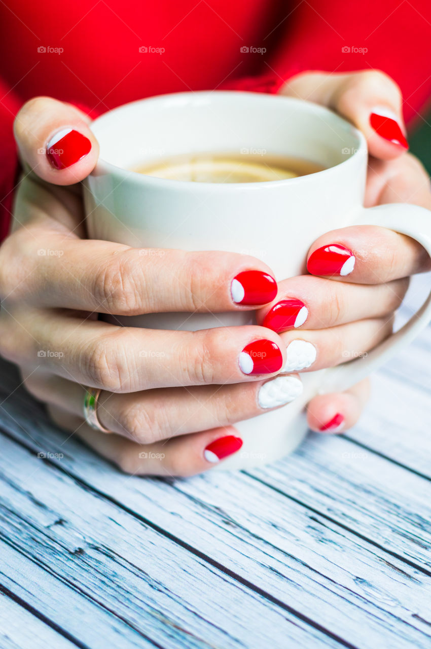 woman hand with cup of tea