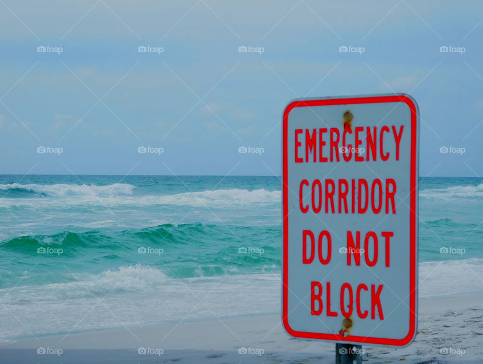 Emergency corridor do not block sign at beach