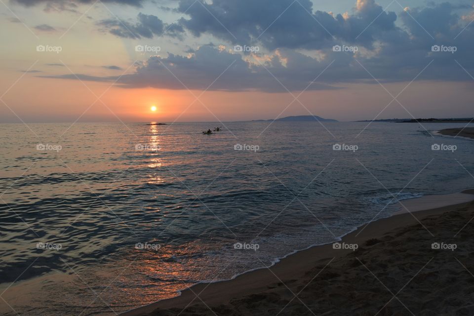 Greece summer sunset canoeing. Greece summer sunset canoeing