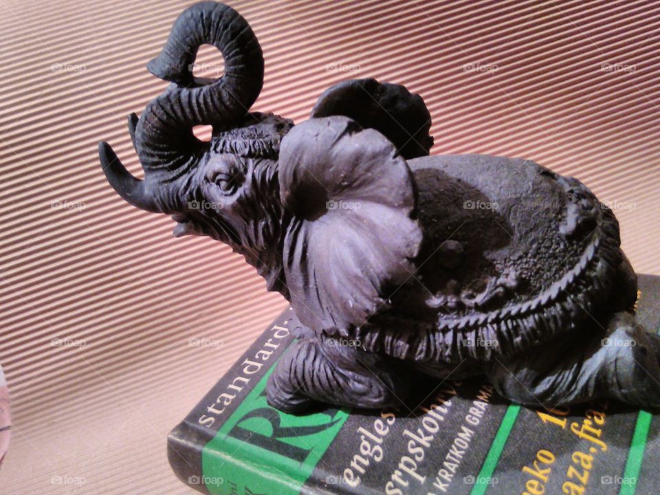 elephant sculpture on dictionary