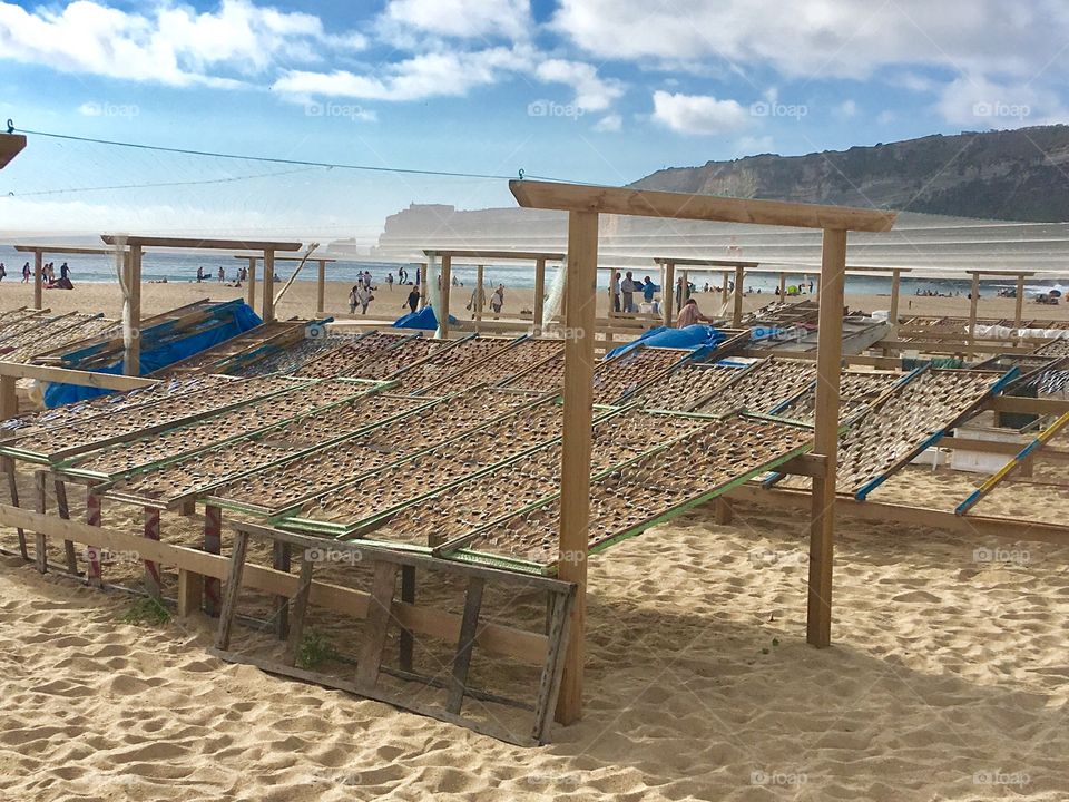 Selling dry fish at the beach 