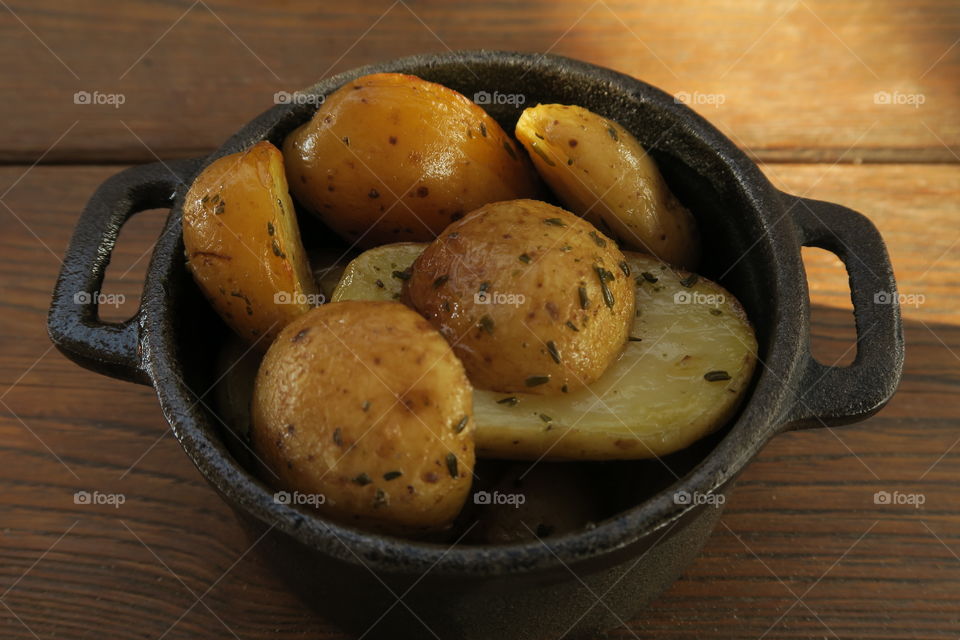 Boiled cut potatoes on a wooden table