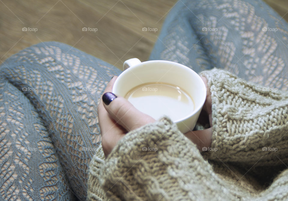 girl holding in the hands of a Cup with coffee