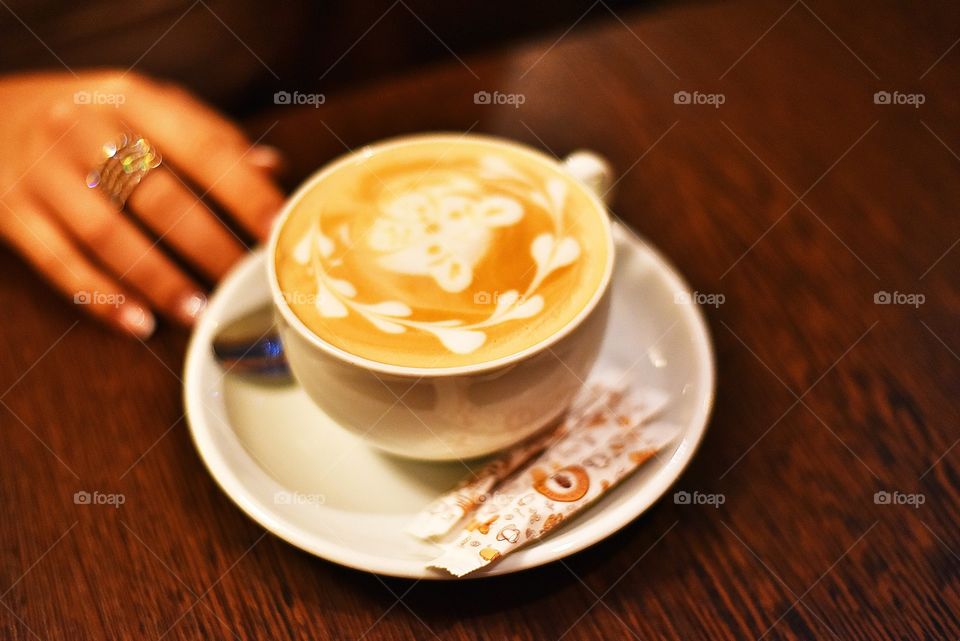 Cup of a coffee on wooden table