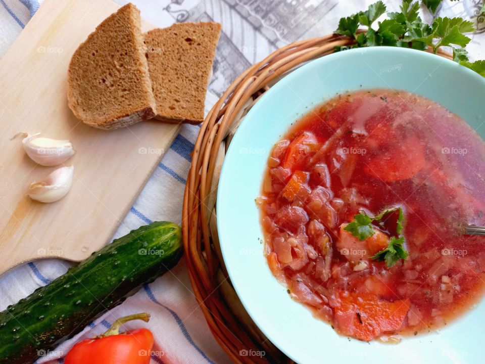 vegetable soup with cabbage - borsch, vegetables, herbs and rye bread for lunch