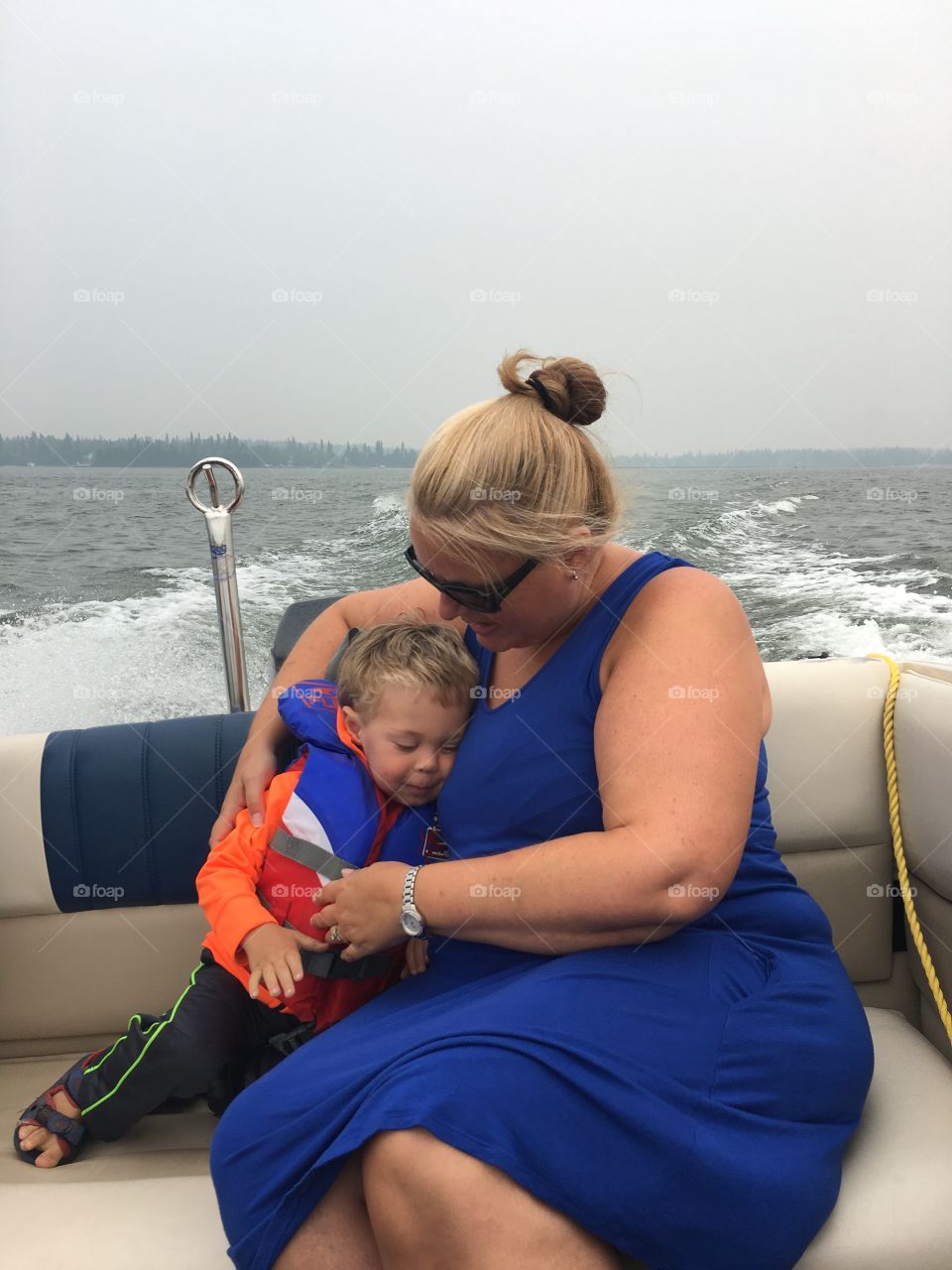 Loving the boat ride and loving his buddy