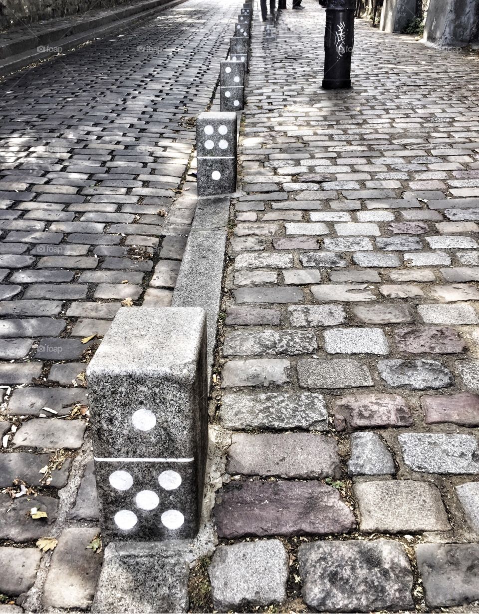 Domino Effect. A cobblestone street in Montmartre, Paris. 