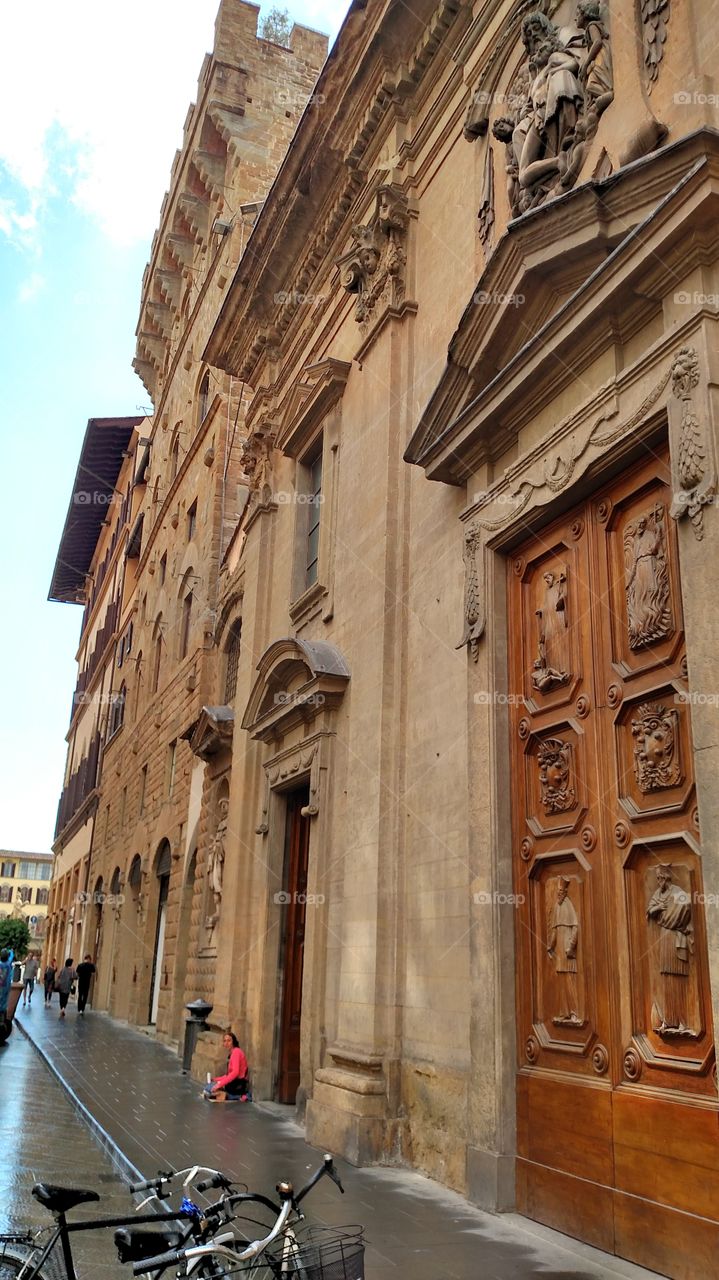 Lovely ancient carved wooden door in Florence, Italy