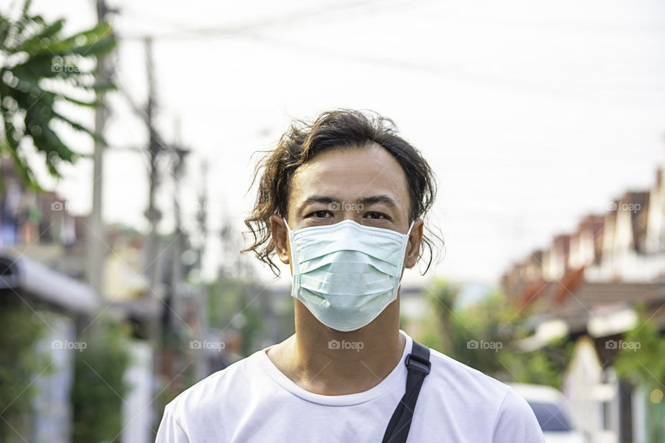 Asean man wear a mask to prevent dust in Bangkok ,Thailand