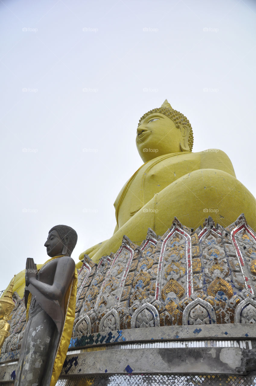 Big Yellow Buddha is located at Si Chang  Island, Attraction in Eastern Thailand.