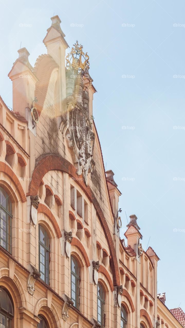 a fragment of the beautiful facade of the school in the rays of the sun