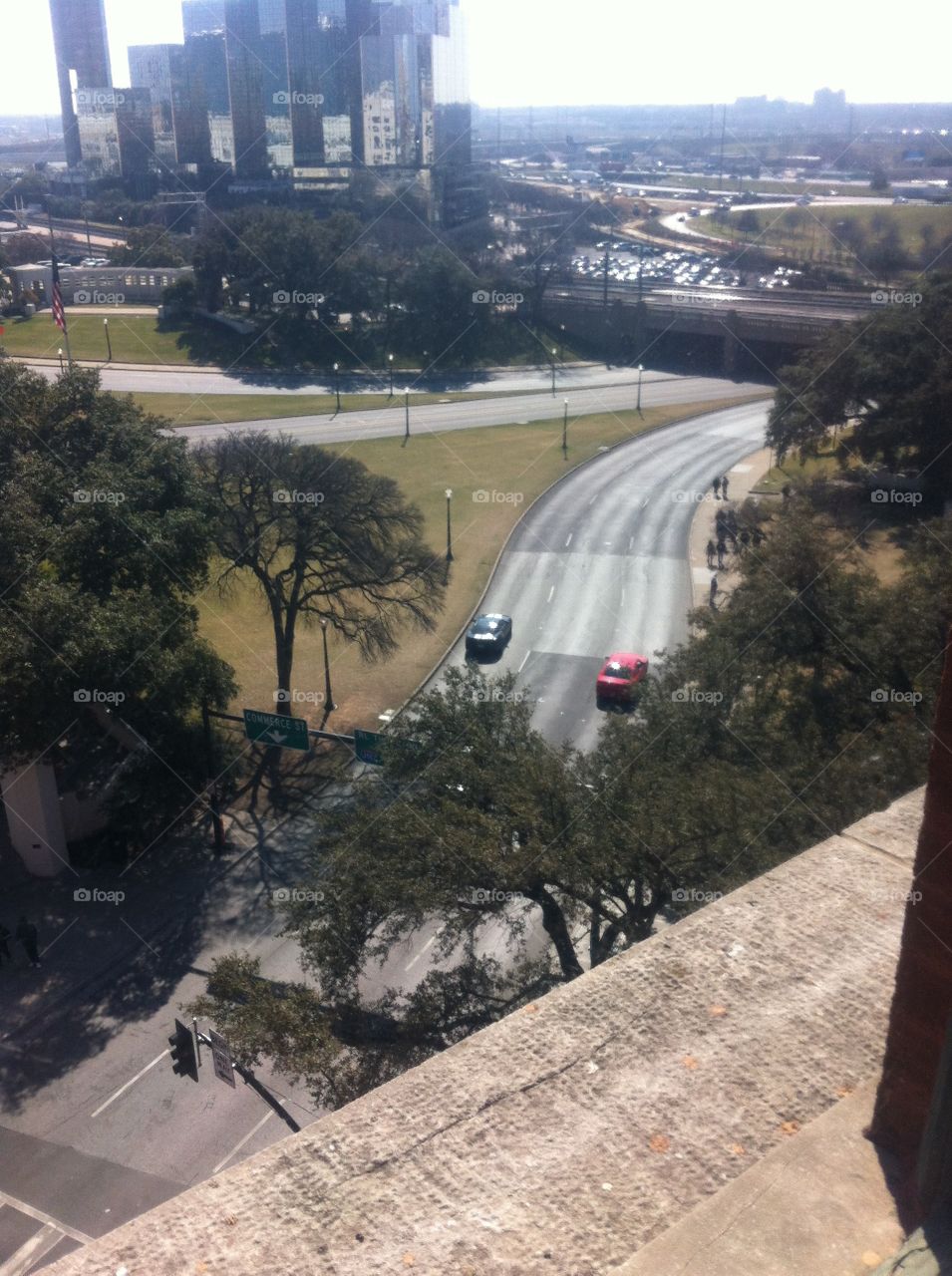 Dealey Plaza in Dallas, Texas from the Texas School Book Depository. This photo shows how tall the trees grew since the day JFK was shot and the precision needed to hit such a precise target from a far distance. 