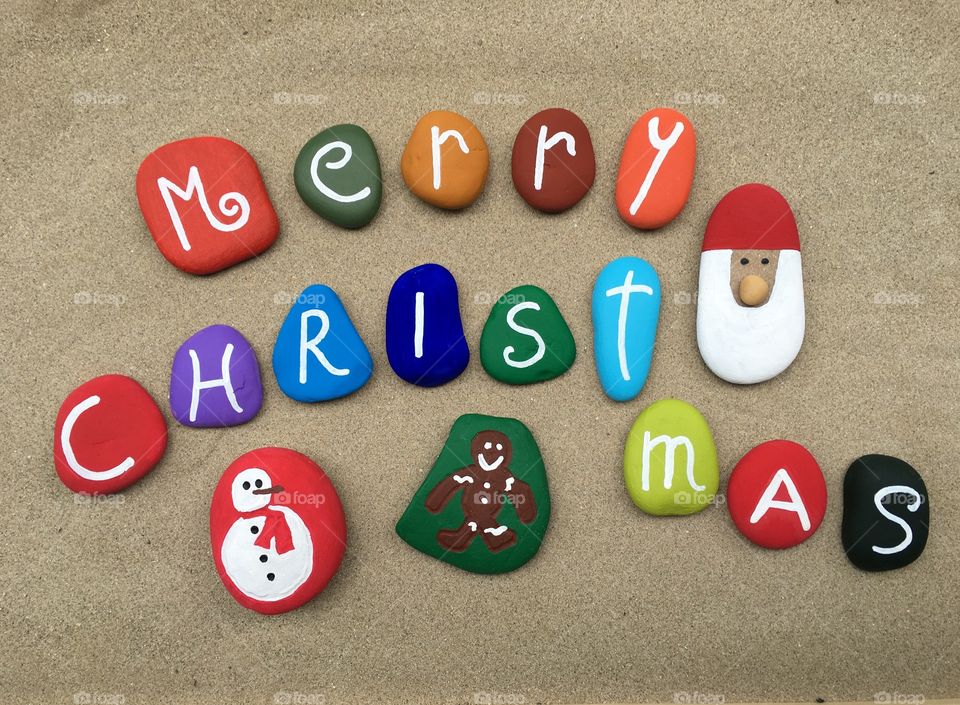 Merry Christmas message with multicolored stones composition