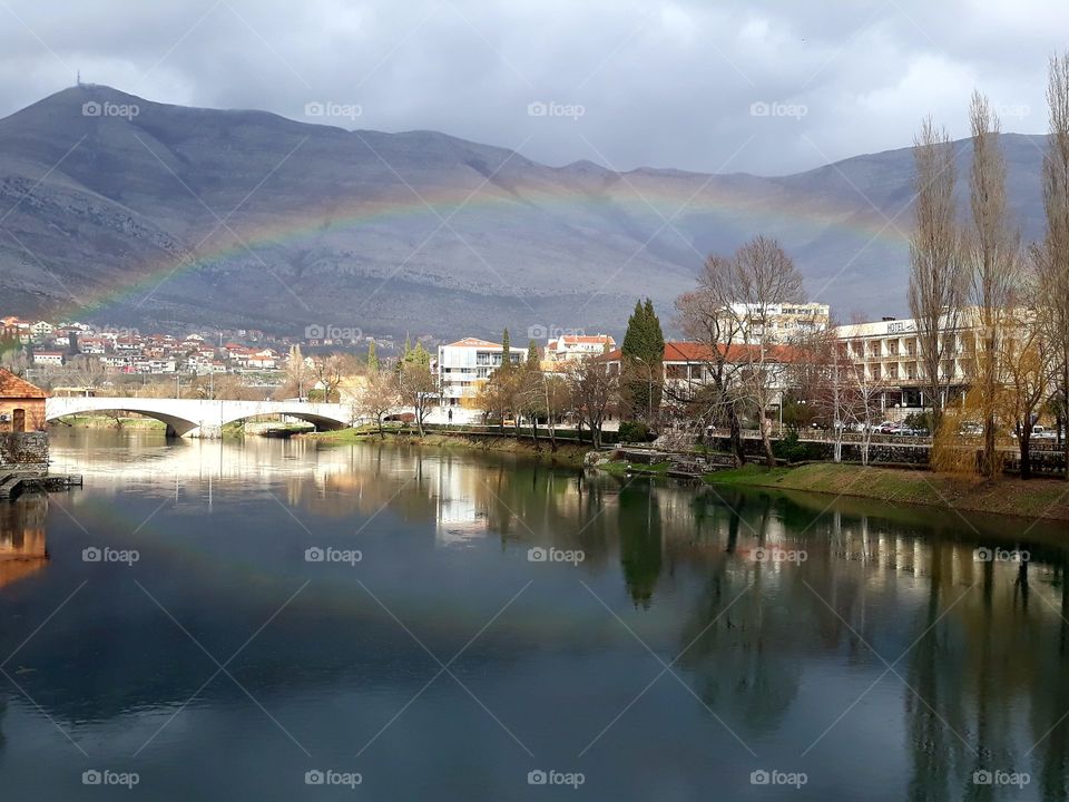 Rainbow, reflection in water