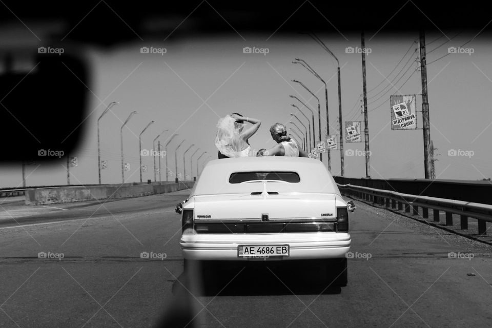 girls in white car