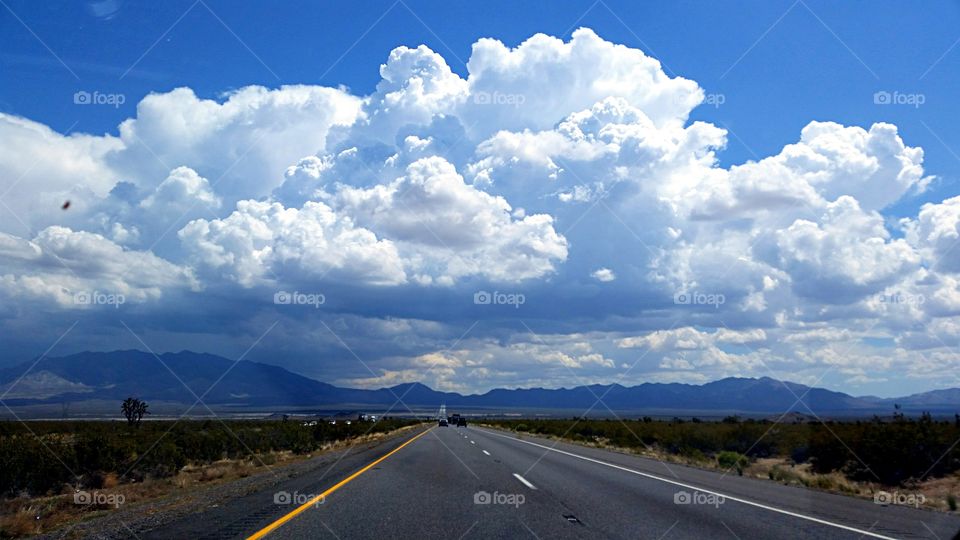 Desert Highway . Driving into the clouds on a desert highway.
