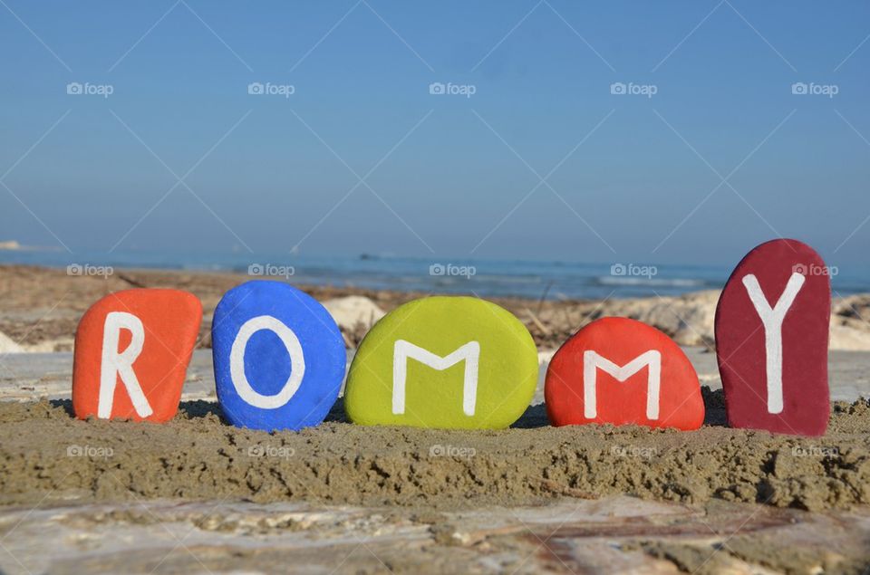 Rommy, male name on colourful stones
