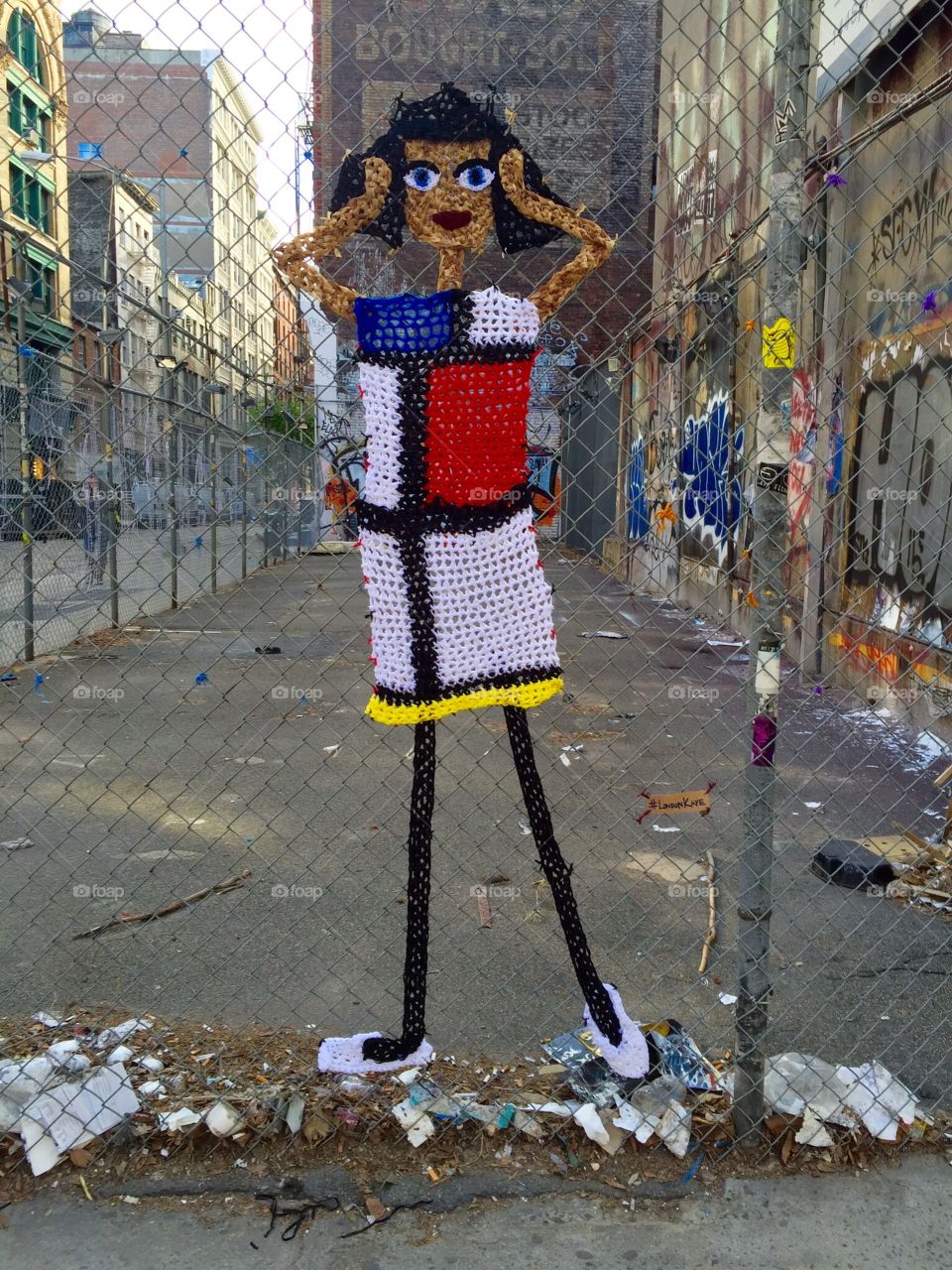 Lady on the fence. Artistic lady on a fence in soho 