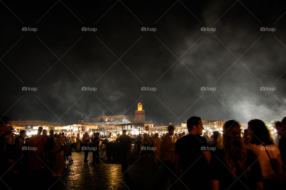 Fuming Jemaa el-Fnaa . light are glowing and fumes are coming out the street stoves