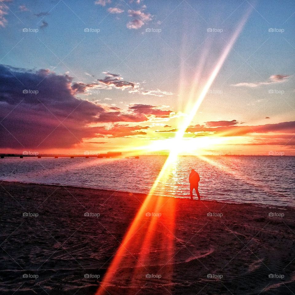 Sunset in Malmö, Sweden. Me and my boyfriend having a beautiful walk on the beach after a rainy afternoon.