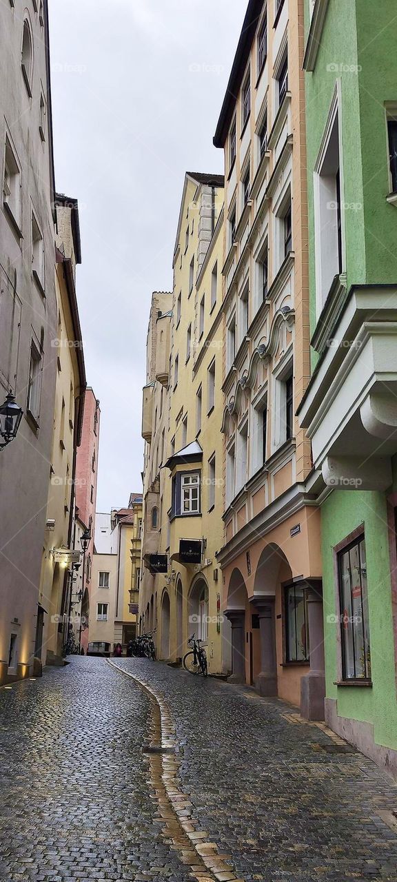 “Regensburg”, Germany is located at the northernmost point of the “Danube”. It features many picturesque areas such as this narrow cobblestone alley way winding its way through the town. 2023. Hypnotic Productions