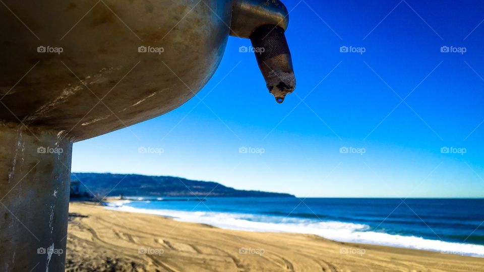 Water Drop From Fresh Water Wash At The Beach