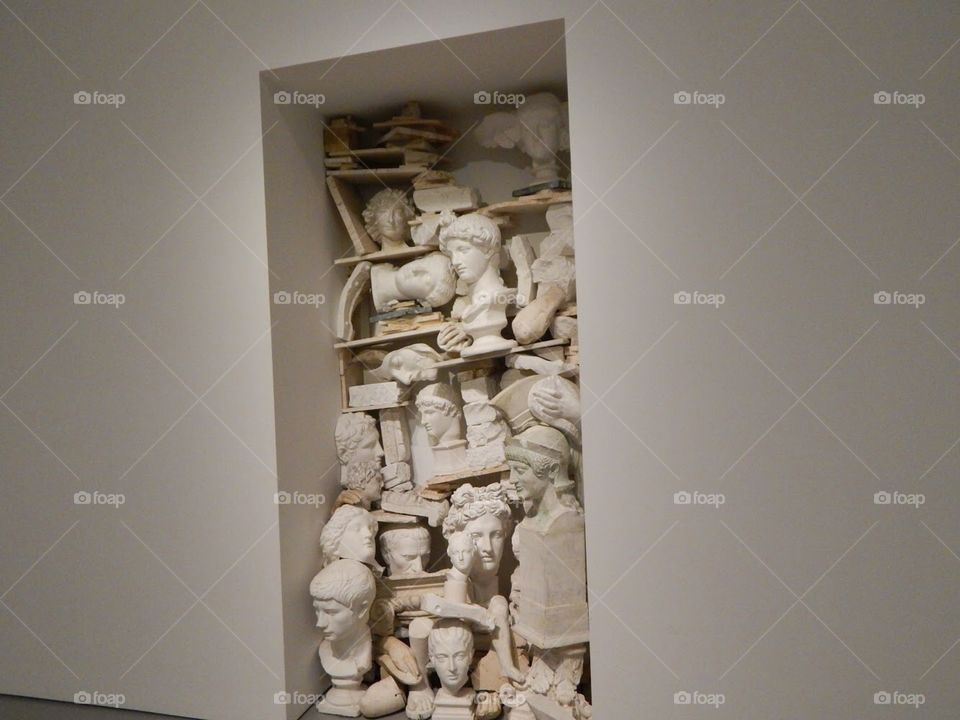 art exhibit statues jammed into closet