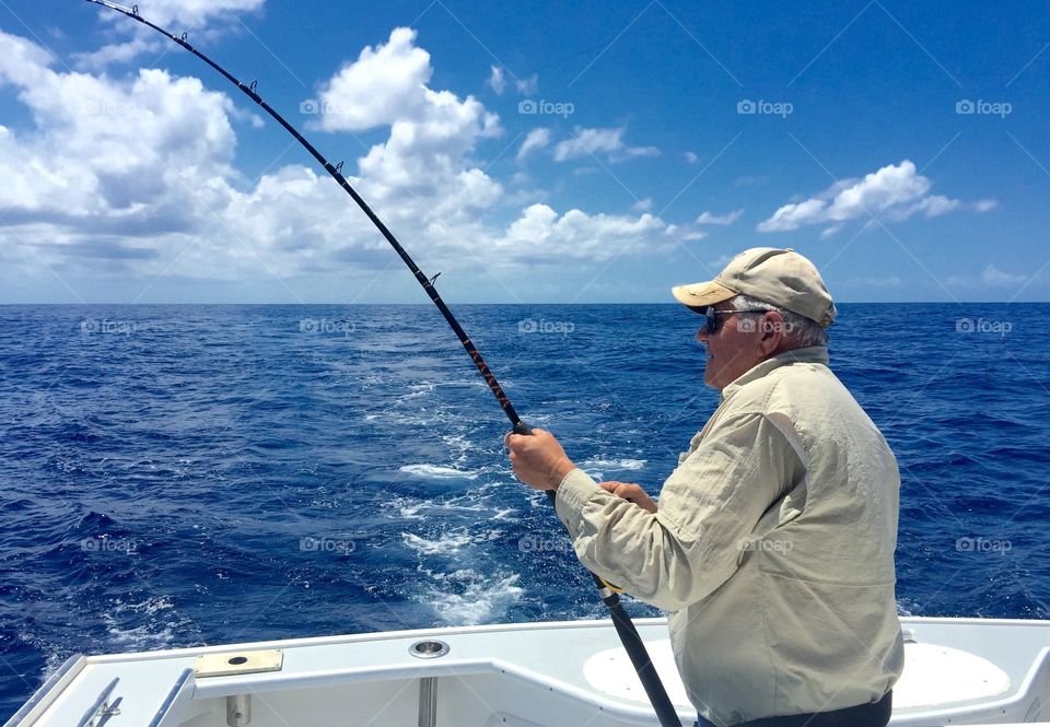 Mature man fishing in sea
